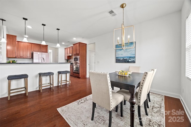 8312 Compton Acres Ln, Waxhaw, NC 28173 - dining room featuring a chandelier, recessed lighting, and dark wood-style floors
