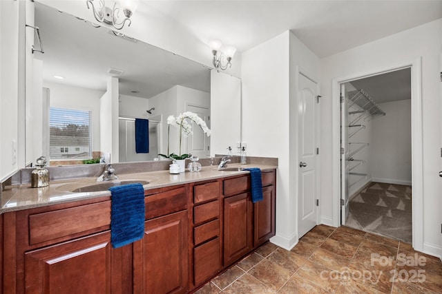 8312 Compton Acres Ln, Waxhaw, NC 28173 - bathroom featuring a shower stall, double vanity, and a walk in closet