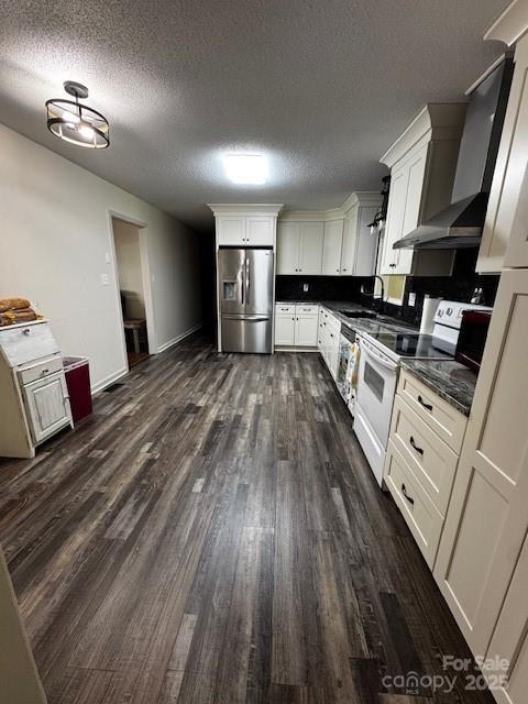 3375 Shepherd Rd, Maiden, NC 28650 - kitchen featuring stainless steel fridge, white electric range oven, a textured ceiling, dark wood finished floors, and wall chimney range hood