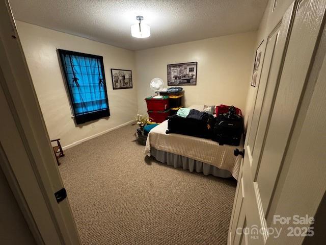 3375 Shepherd Rd, Maiden, NC 28650 - carpeted bedroom featuring a textured ceiling
