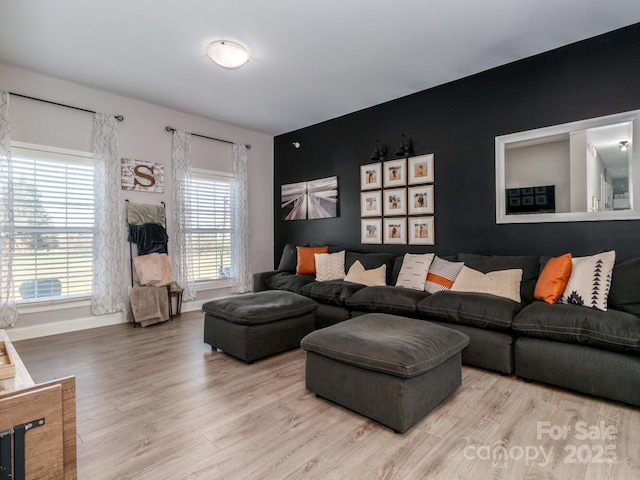 4652 Rocky Hollow Rd 4658, 4654, Davidson, NC 28036 - living room featuring wood finished floors and an accent wall