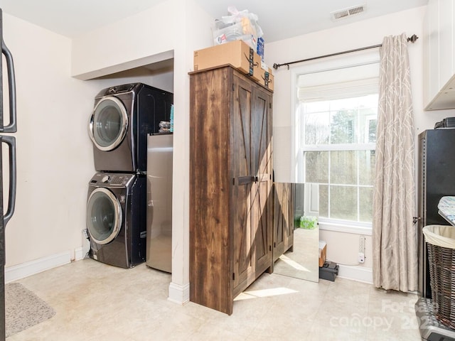 4652 Rocky Hollow Rd 4658, 4654, Davidson, NC 28036 - washroom with stacked washing machine and dryer and healthy amount of natural light