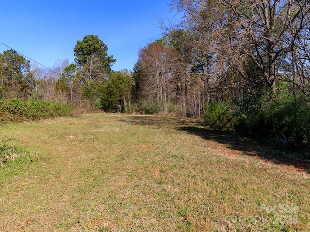 4652 Rocky Hollow Rd 4658, 4654, Davidson, NC 28036 - view of green lawn featuring a view of trees