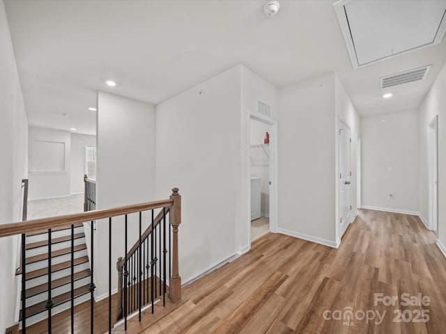 9582 Creighton Rd NW, Concord, NC 28027 - hall featuring attic access, an upstairs landing, light wood finished floors, and recessed lighting