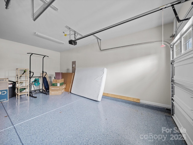 9582 Creighton Rd NW, Concord, NC 28027 - garage featuring a garage door opener and electric panel