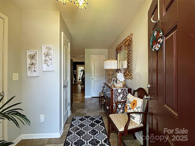 9608 Brackenview Ct, Charlotte, NC 28214 - foyer with baseboards and dark stone finish flooring