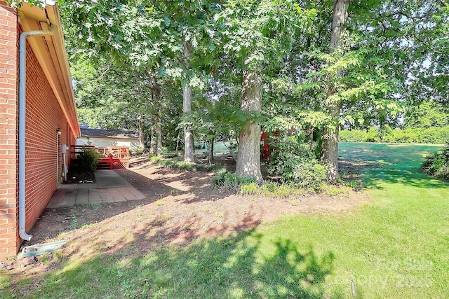 16509 Kimbolten Dr, Huntersville, NC 28078 - view of grassy yard with a deck