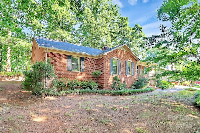 16509 Kimbolten Dr, Huntersville, NC 28078 - view of front of home with brick siding and a chimney