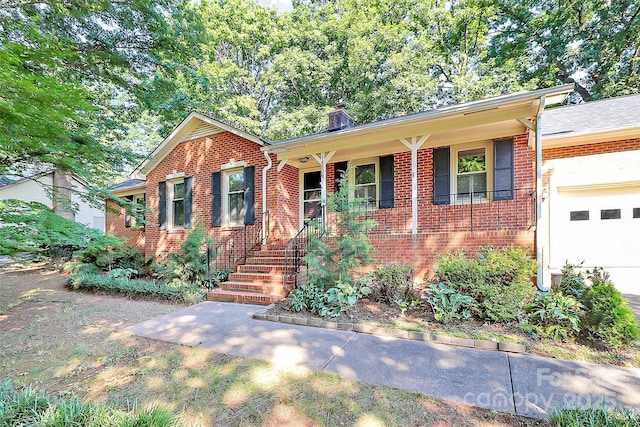 16509 Kimbolten Dr, Huntersville, NC 28078 - view of front facade with brick siding, covered porch, a garage, and a chimney