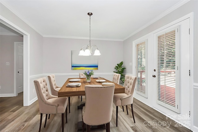 16509 Kimbolten Dr, Huntersville, NC 28078 - dining space with wood finished floors, ornamental molding, and a chandelier