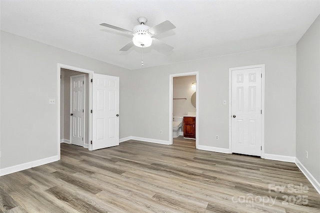 16509 Kimbolten Dr, Huntersville, NC 28078 - unfurnished bedroom with wood finished floors, ensuite bathroom, and a ceiling fan
