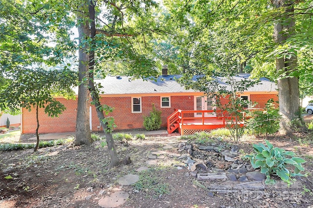 16509 Kimbolten Dr, Huntersville, NC 28078 - rear view of property with a wooden deck, brick siding, and a chimney