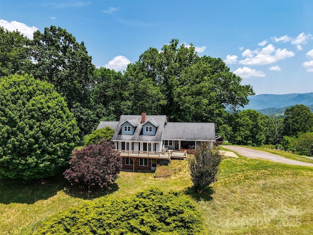 80 Gobblers Knob Dr, Clyde, NC 28721 - shingle-style home with a wooden deck, a front yard, driveway, and a chimney