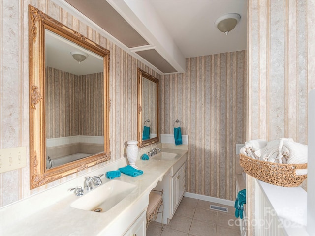 80 Gobblers Knob Dr, Clyde, NC 28721 - bathroom featuring wallpapered walls, double vanity, tile patterned flooring, and a bath
