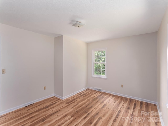 80 Gobblers Knob Dr, Clyde, NC 28721 - spare room featuring light wood-style floors and baseboards