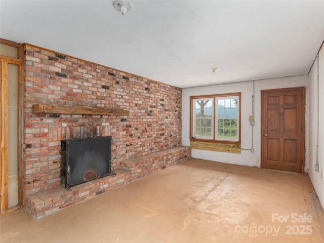 80 Gobblers Knob Dr, Clyde, NC 28721 - unfurnished living room featuring a brick fireplace