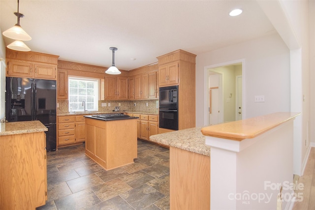 9117 Castle Garden Ln, Charlotte, NC 28215 - kitchen with black appliances, a center island, tasteful backsplash, hanging light fixtures, and recessed lighting