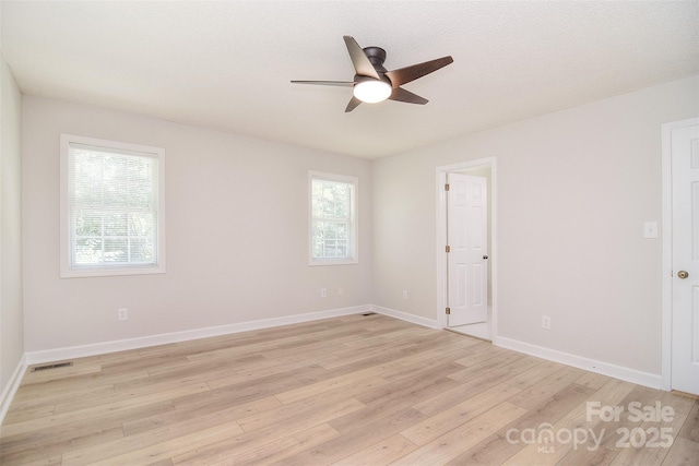 9117 Castle Garden Ln, Charlotte, NC 28215 - spare room featuring light wood finished floors and a ceiling fan