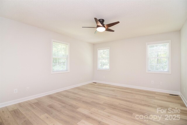 9117 Castle Garden Ln, Charlotte, NC 28215 - unfurnished room with ceiling fan and light wood finished floors