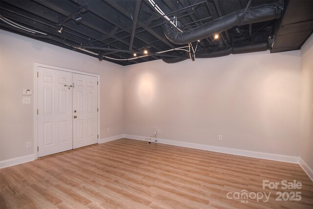 9117 Castle Garden Ln, Charlotte, NC 28215 - basement featuring light wood-style flooring