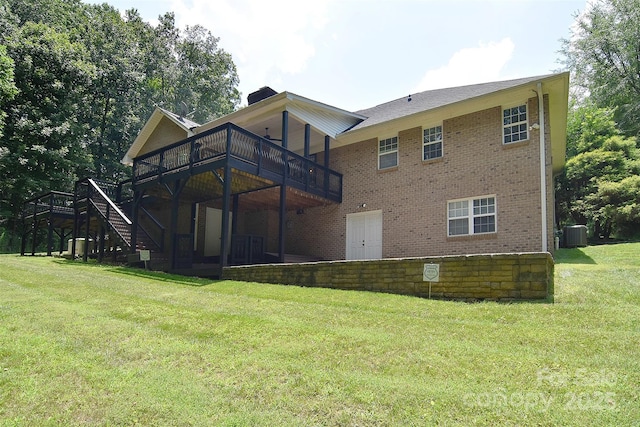9117 Castle Garden Ln, Charlotte, NC 28215 - rear view of property featuring a yard, brick siding, a wooden deck, and stairway