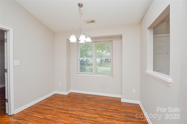 5424 Amado St, Charlotte, NC 28215 - empty room with a chandelier and wood finished floors