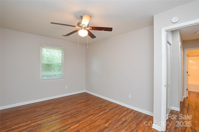 5424 Amado St, Charlotte, NC 28215 - spare room with a smoke detector, wood finished floors, ceiling fan, and a textured ceiling