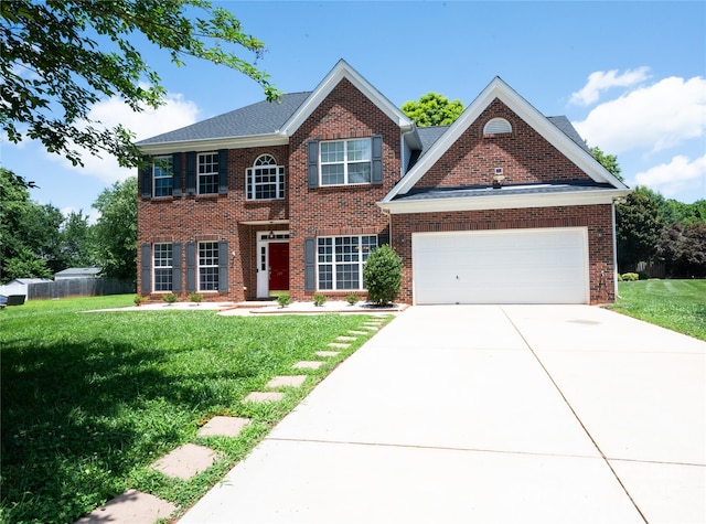 219 Harrowfield Hts, York, SC 29745 - colonial inspired home featuring a front yard, concrete driveway, a garage, and brick siding