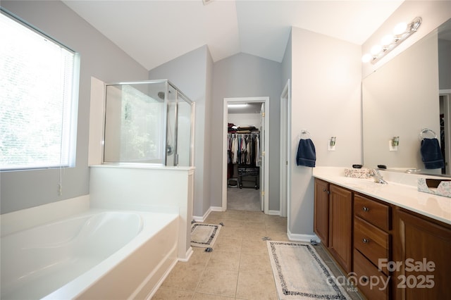 219 Harrowfield Hts, York, SC 29745 - bathroom featuring a shower stall, vanity, a bath, a walk in closet, and lofted ceiling