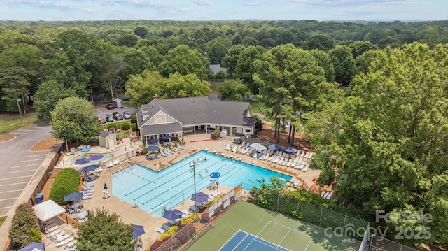 9121 Four Acre Ct, Charlotte, NC 28210 - bird's eye view of a heavily wooded area and a pool area