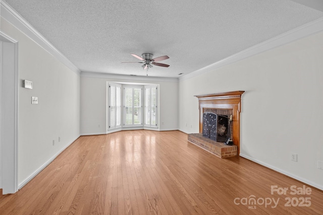 9121 Four Acre Ct, Charlotte, NC 28210 - unfurnished living room featuring a textured ceiling, ceiling fan, ornamental molding, light wood-style floors, and a brick fireplace