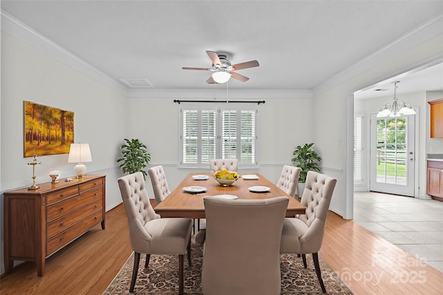 9121 Four Acre Ct, Charlotte, NC 28210 - dining space with plenty of natural light, light wood-style floors, ceiling fan, crown molding, and a chandelier