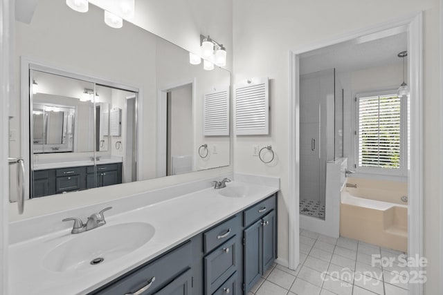 9121 Four Acre Ct, Charlotte, NC 28210 - bathroom with tile patterned floors, a garden tub, a stall shower, and double vanity