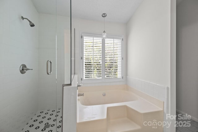 9121 Four Acre Ct, Charlotte, NC 28210 - full bathroom featuring a shower stall, a garden tub, plenty of natural light, and tile patterned floors