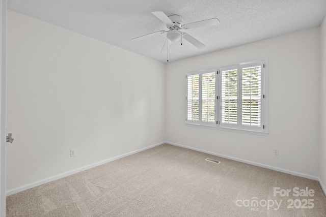 9121 Four Acre Ct, Charlotte, NC 28210 - empty room featuring carpet floors, ceiling fan, and a textured ceiling