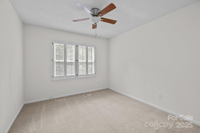 9121 Four Acre Ct, Charlotte, NC 28210 - empty room featuring a textured ceiling, carpet flooring, and ceiling fan