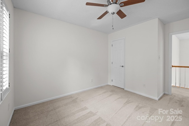 9121 Four Acre Ct, Charlotte, NC 28210 - empty room with ceiling fan, carpet floors, and healthy amount of natural light