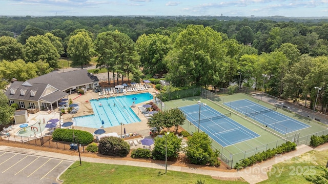 9121 Four Acre Ct, Charlotte, NC 28210 - drone / aerial view of a heavily wooded area and a pool area