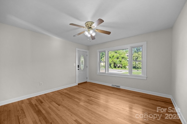 109 Short St, Waynesville, NC 28786 - spare room featuring light wood-type flooring and ceiling fan