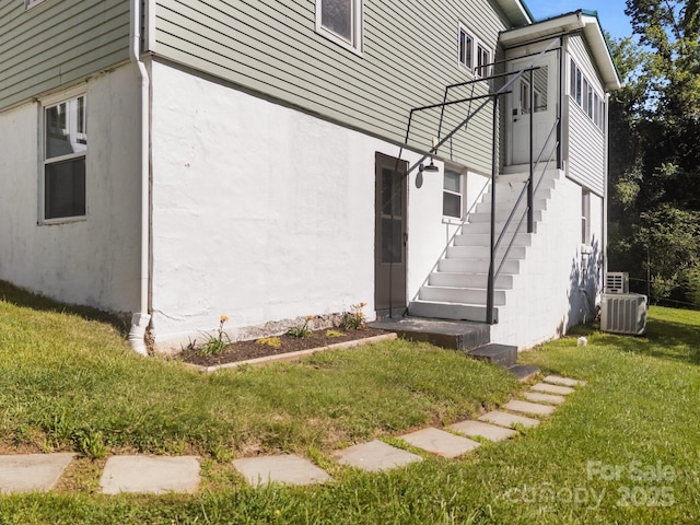 109 Short St, Waynesville, NC 28786 - view of side of property with stairs, a lawn, and stucco siding