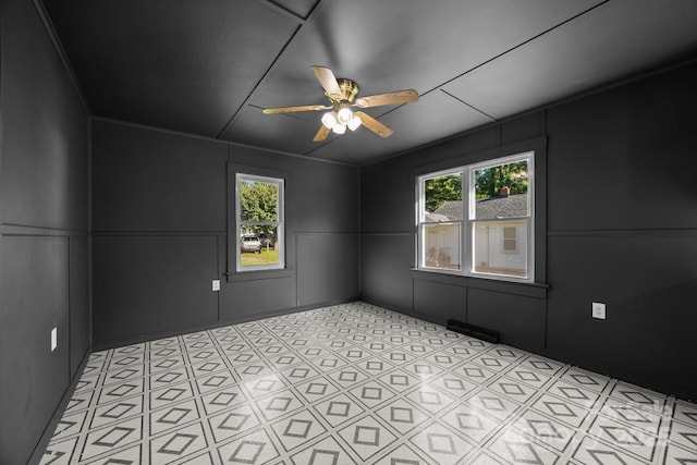 109 Short St, Waynesville, NC 28786 - empty room with a decorative wall, a ceiling fan, and plenty of natural light