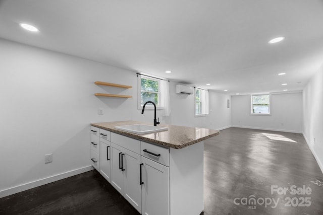 109 Short St, Waynesville, NC 28786 - kitchen with a wall mounted air conditioner, recessed lighting, a peninsula, white cabinets, and open shelves