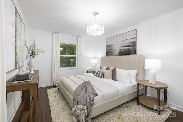 4017 Sulkirk Rd, Charlotte, NC 28210 - bedroom featuring wood finished floors, a chandelier, and crown molding