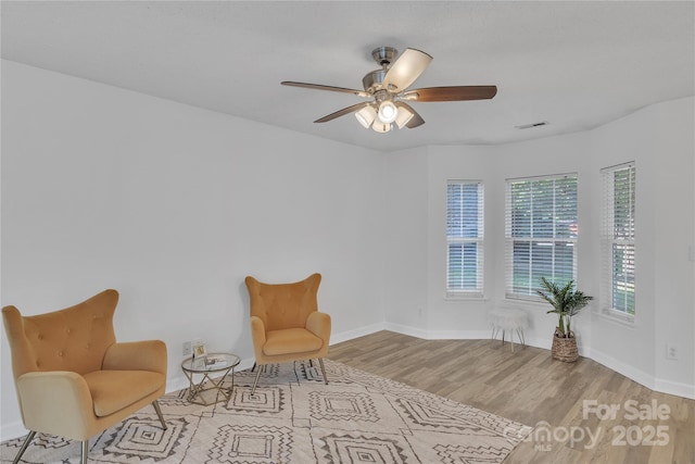 11407 Lenswood Ct, Charlotte, NC 28214 - sitting room with wood finished floors and a ceiling fan