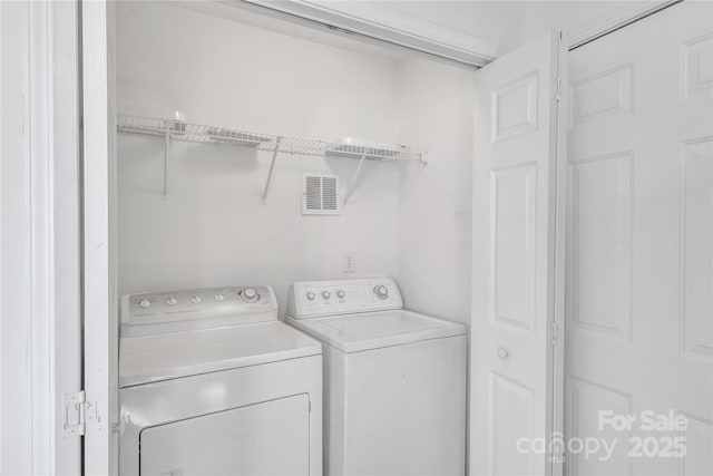 11407 Lenswood Ct, Charlotte, NC 28214 - laundry area with washer and dryer