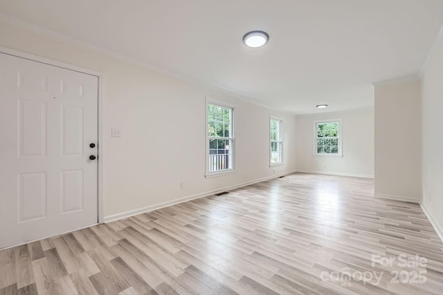 1224 E Woodlawn Rd, Charlotte, NC 28209 - empty room with crown molding and light wood finished floors