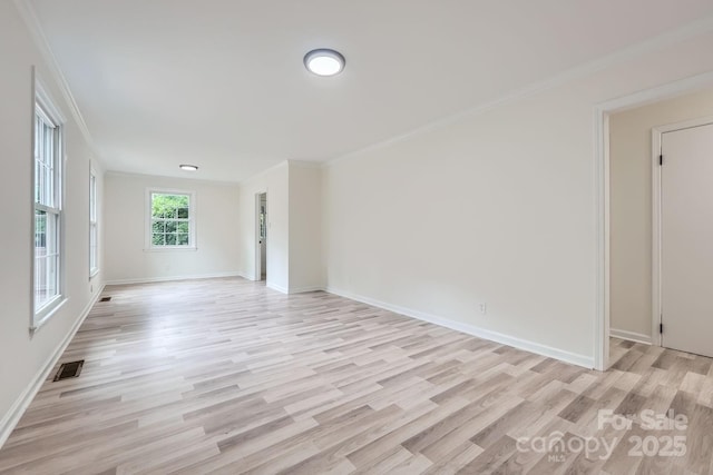 1224 E Woodlawn Rd, Charlotte, NC 28209 - empty room featuring light wood-type flooring and ornamental molding