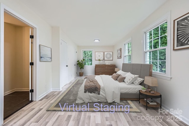 1224 E Woodlawn Rd, Charlotte, NC 28209 - bedroom with wood finished floors and baseboards