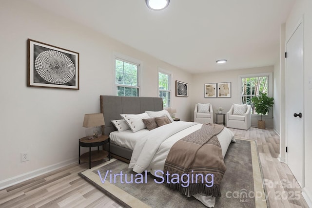 1224 E Woodlawn Rd, Charlotte, NC 28209 - bedroom featuring light wood-style flooring and baseboards