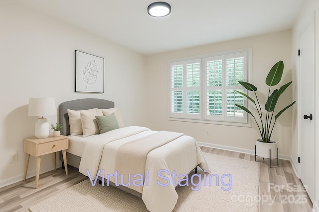 1224 E Woodlawn Rd, Charlotte, NC 28209 - bedroom with wood finished floors and baseboards